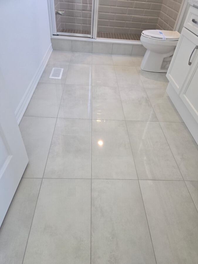 Newly cleaned tile floor in a finished bathroom